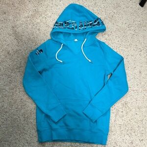 Bright blue, almost teal Under Armour hoodie. Tag missing, size medium